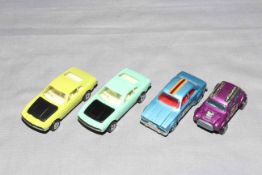 Four Corgi Juniors cars, UNLISTED colour Aston Martin DBS,
