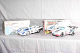 Taiyo Porsche 917 Race Car and ST Toys Porsche 911. Excellent in Excellent boxes.