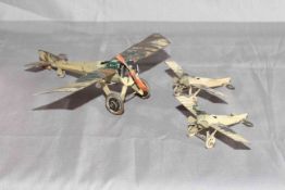 Three early French tinplate Mono planes. 1 being larger scale. Very Good.