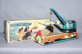 Biller West Germany clockwork tinplate Dock Yard Crane, complete with plastic car and cradle.