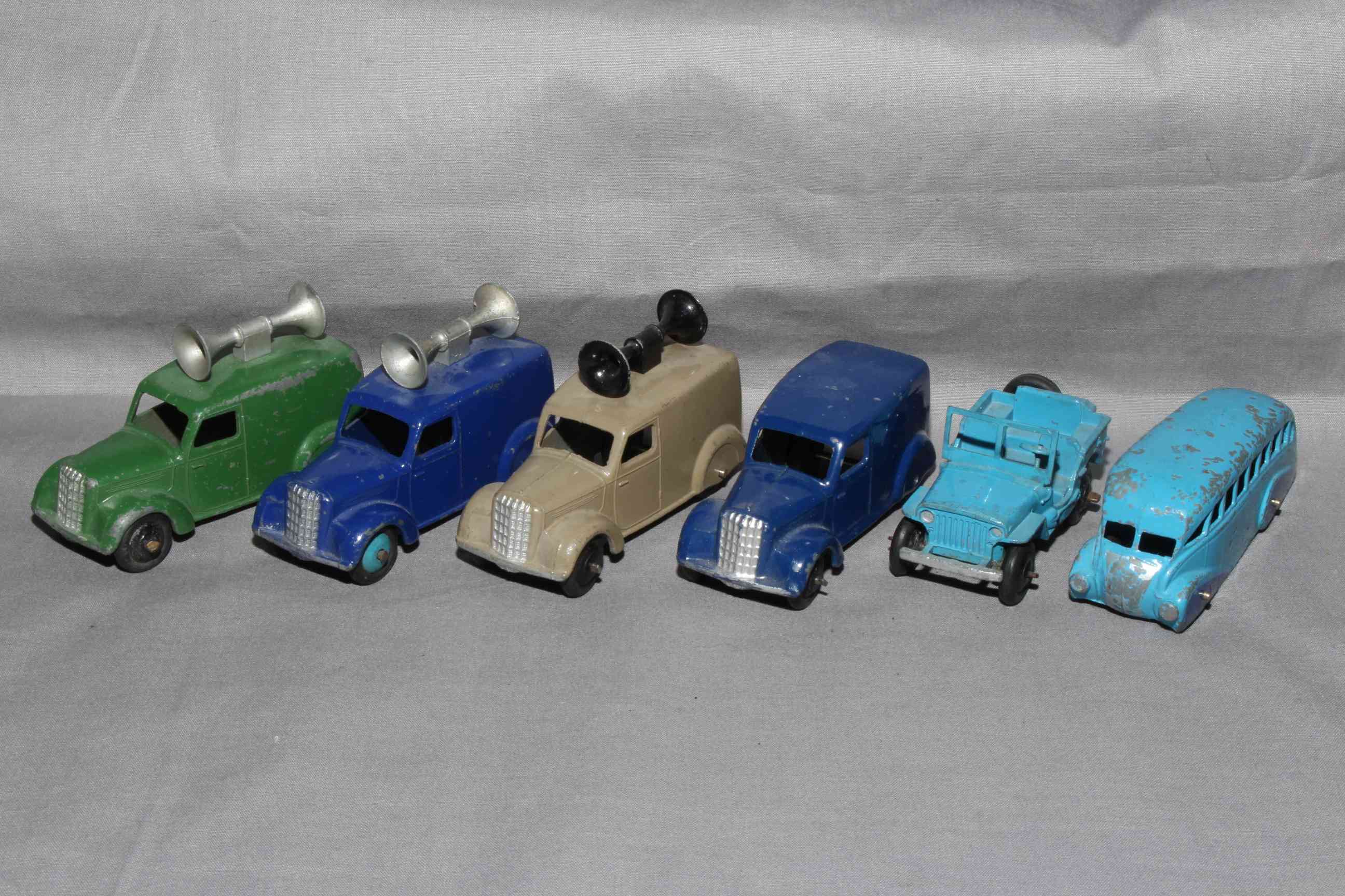 Three Dinky 34c Loudspeaker Vans plus 280 Delivery Van and 25j Jeep. Good to Very Good unboxed.