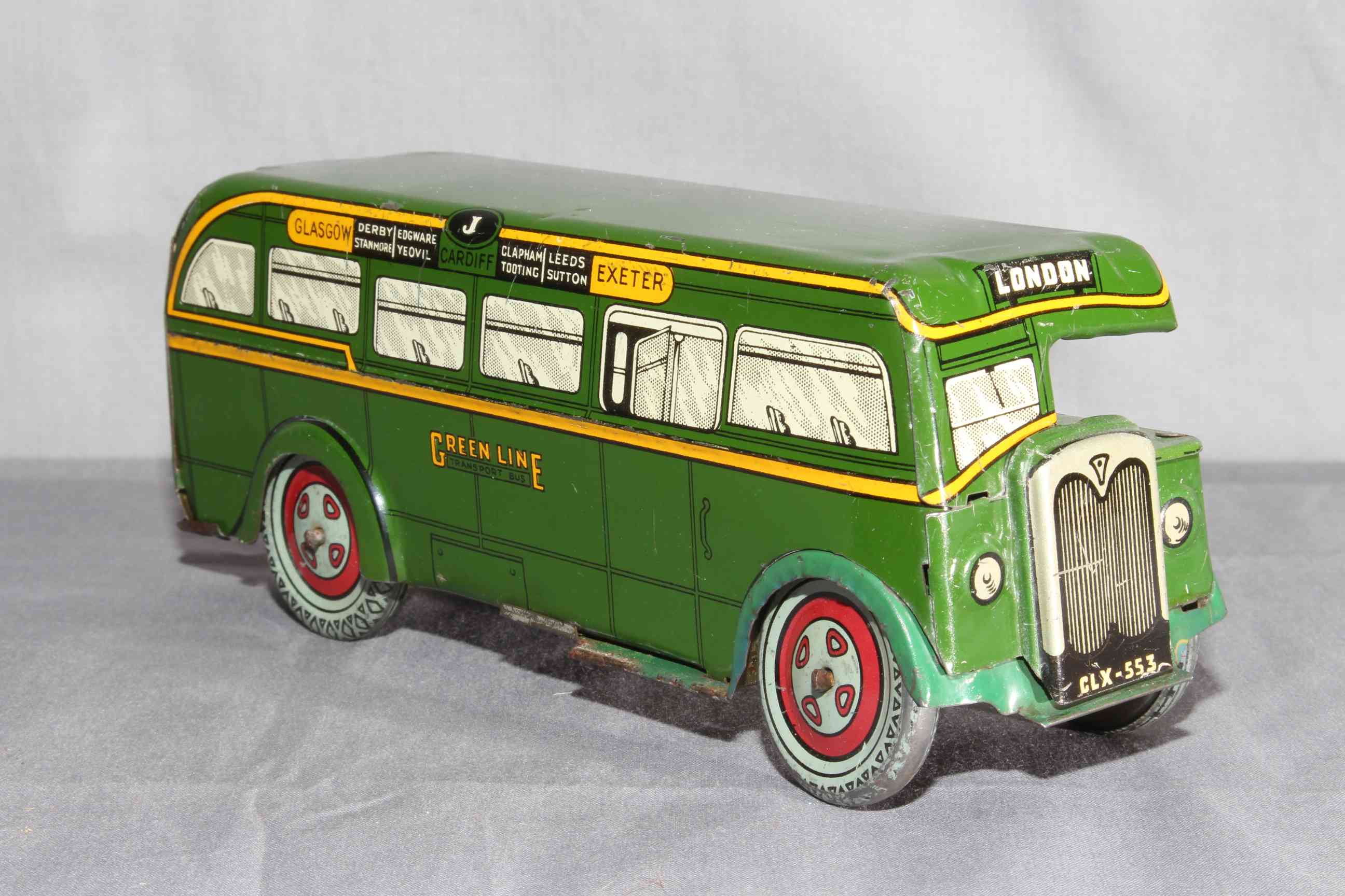 Wells Brimtoy clockwork tinplate Green Line Single Decker Coach. Very Good with minor corrosion.