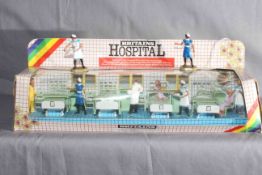 Britains 7857 Hospital Ward Set plus loose figures. Near Mint in Good crushed window box.