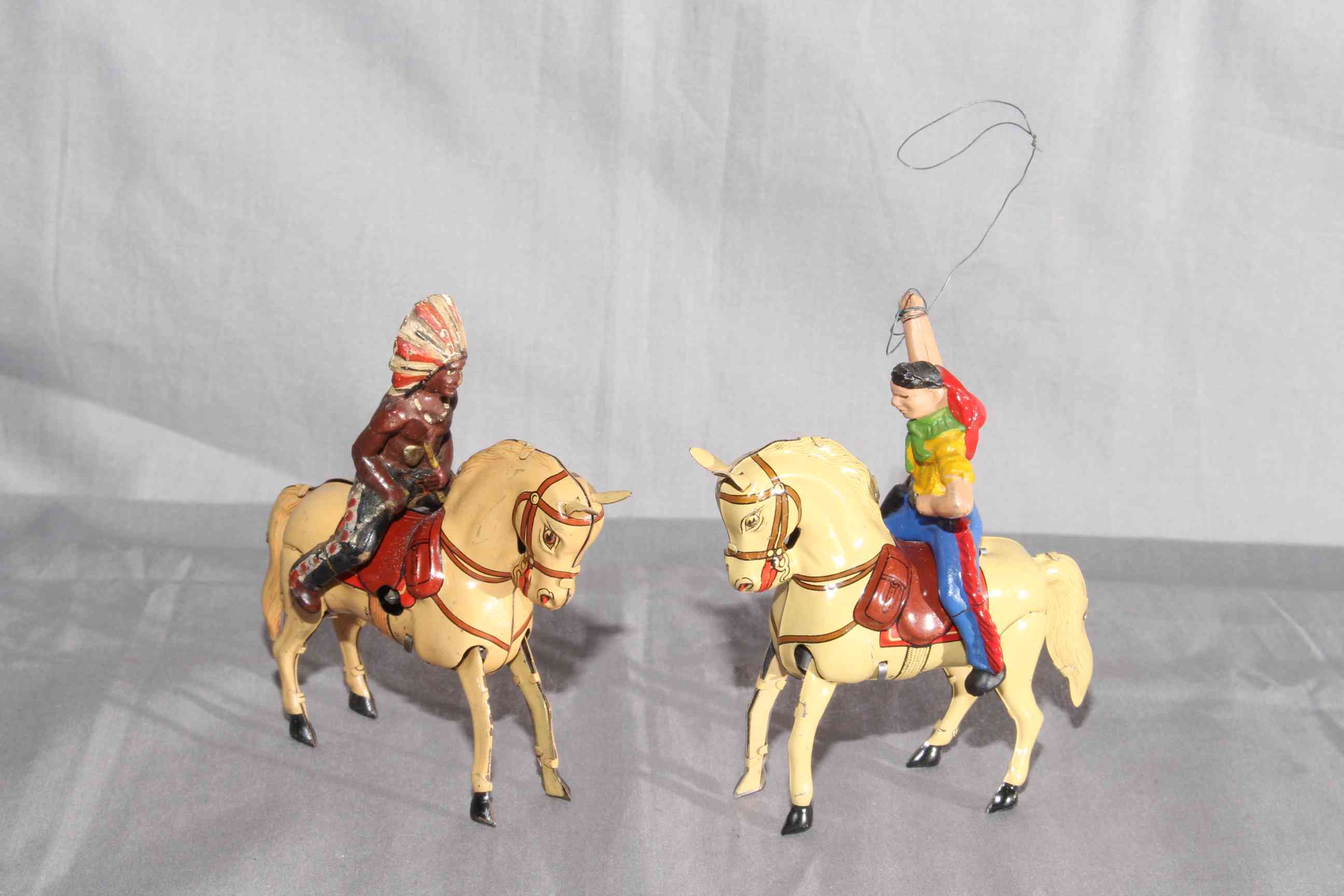 DRGM US Zone Germany clockwork Tinplate Cowboy & Indian on Horseback. Excellent (2).