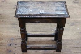 Jointed oak turned leg stool, 46cm high by 44cm wide by 24cm deep. (Wear to top).