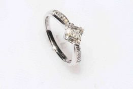 Diamond ring set in 18 carat white gold, having 22 stones, brilliant and baguette cut, size P.