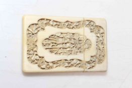 Chinese ivory card case, with deep relief carving of figures, pagoda and flowers, 11.5cm by 7.5cm.