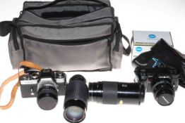 Two Minolta camera's, two lenses, program flash and camera bag.