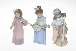 Three Nao musician girls with string instruments, tallest 19cm.