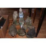 Nine garden ornaments including gnome, owl, hedgehog, etc.