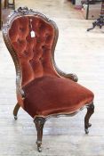 Victorian carved walnut nursing chair in button draylon.