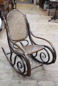 Bentwood rocking chair with bergere panel back and seat (numerous splits in wood).