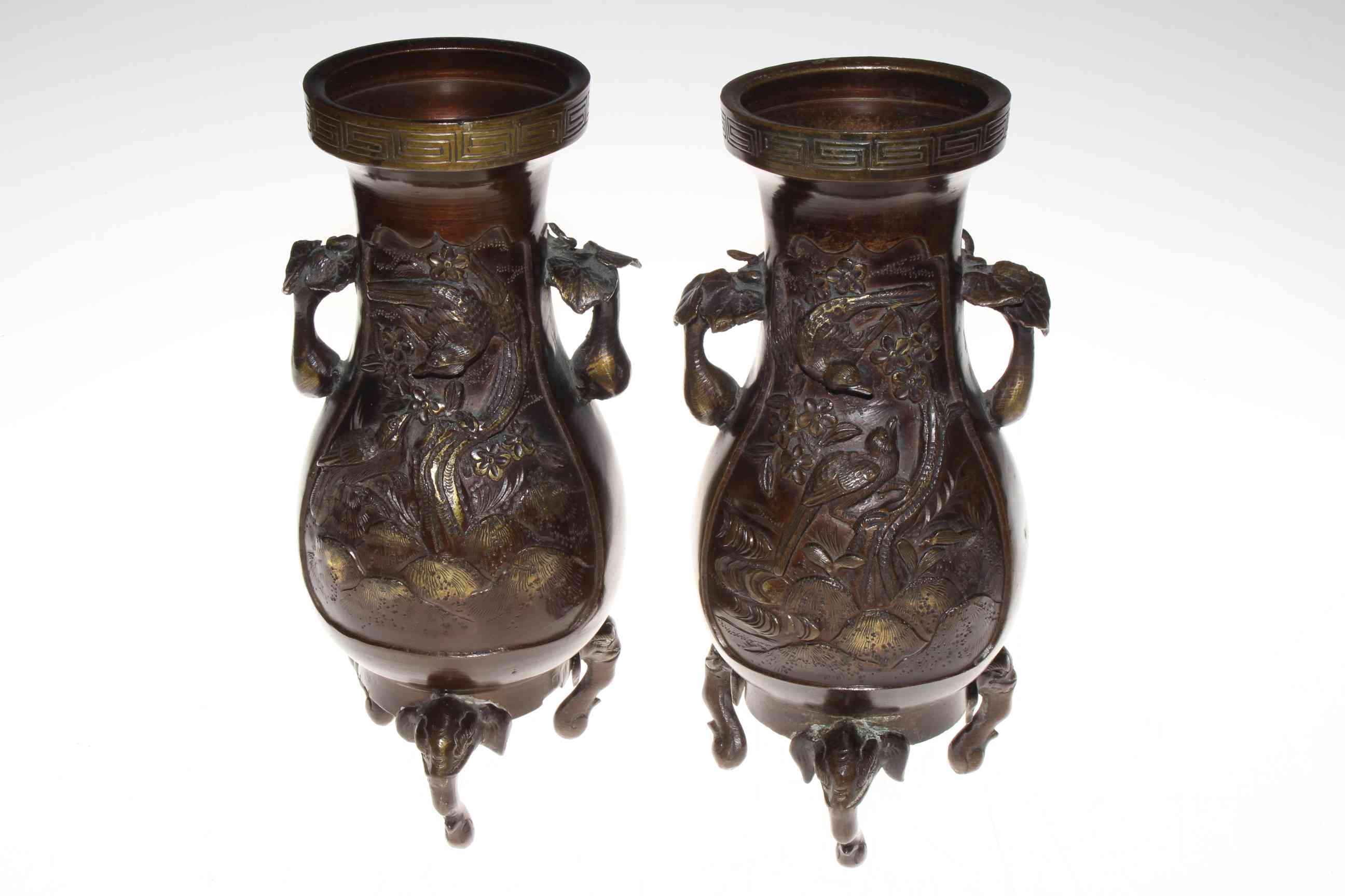 Pair of bronze baluster vases, with relief decoration and on elephant mask legs, 27cm. - Image 2 of 3