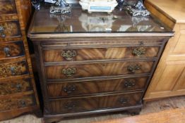 Good mahogany Chippendale style chest of four long graduated drawers having brush slide and blind