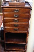 Edwardian music cabinet having five fall front drawers above two open shelves, 110.5cm high by 49.