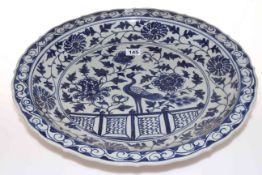 Oriental blue and white charger decorated with exotic bird and flora, 45cm diameter.