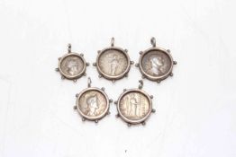 Five ancient Roman/Greek coins in frames, each approximately 2cm diameter.