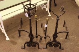 Large pair of wrought iron andirons, 81cm high, small brass fender,