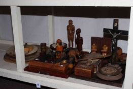 Collection of carved wood items including boxes, figures, animals, bookends, two chopping boards,