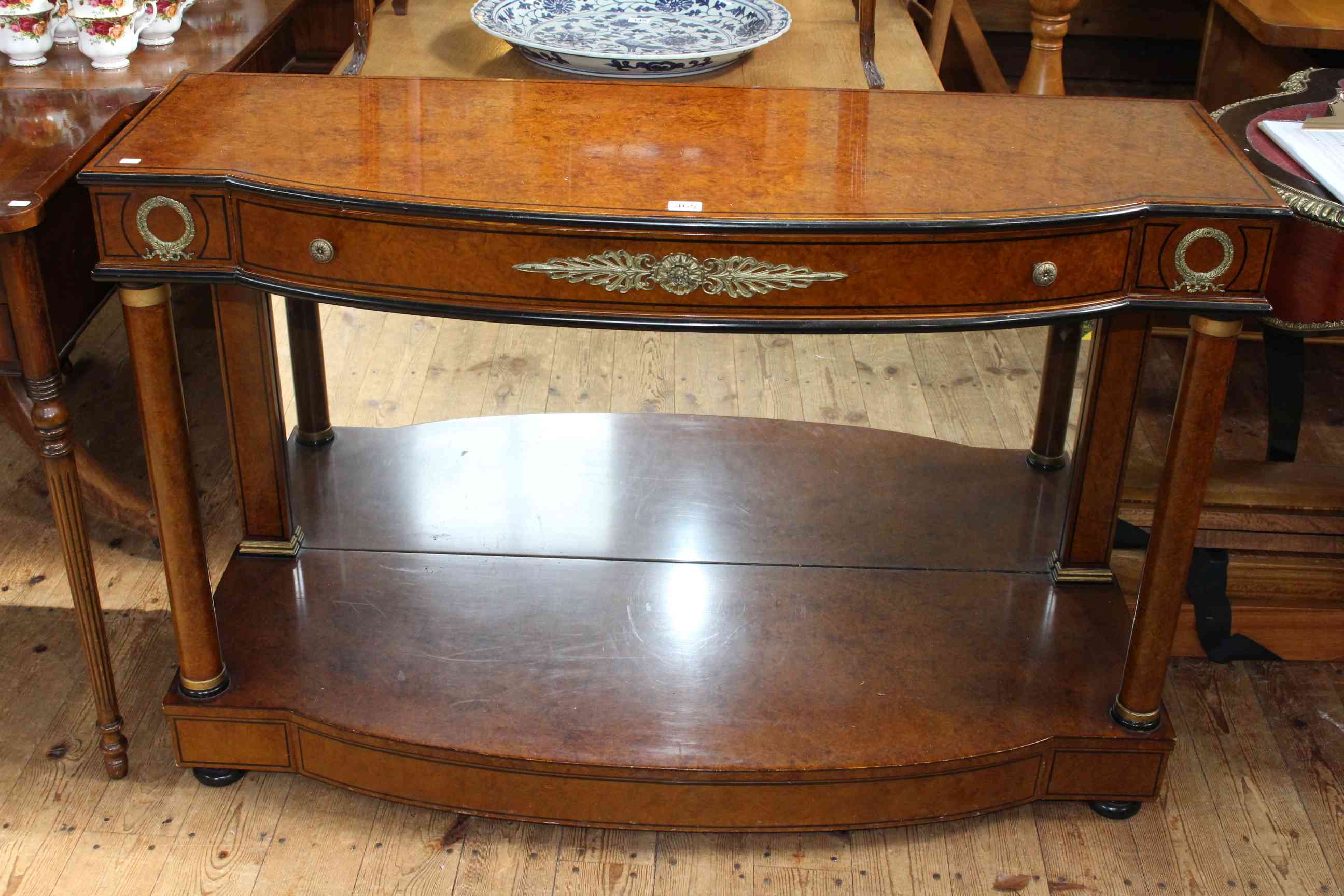 Empire style bow front console in burr veneered with metal mounts,