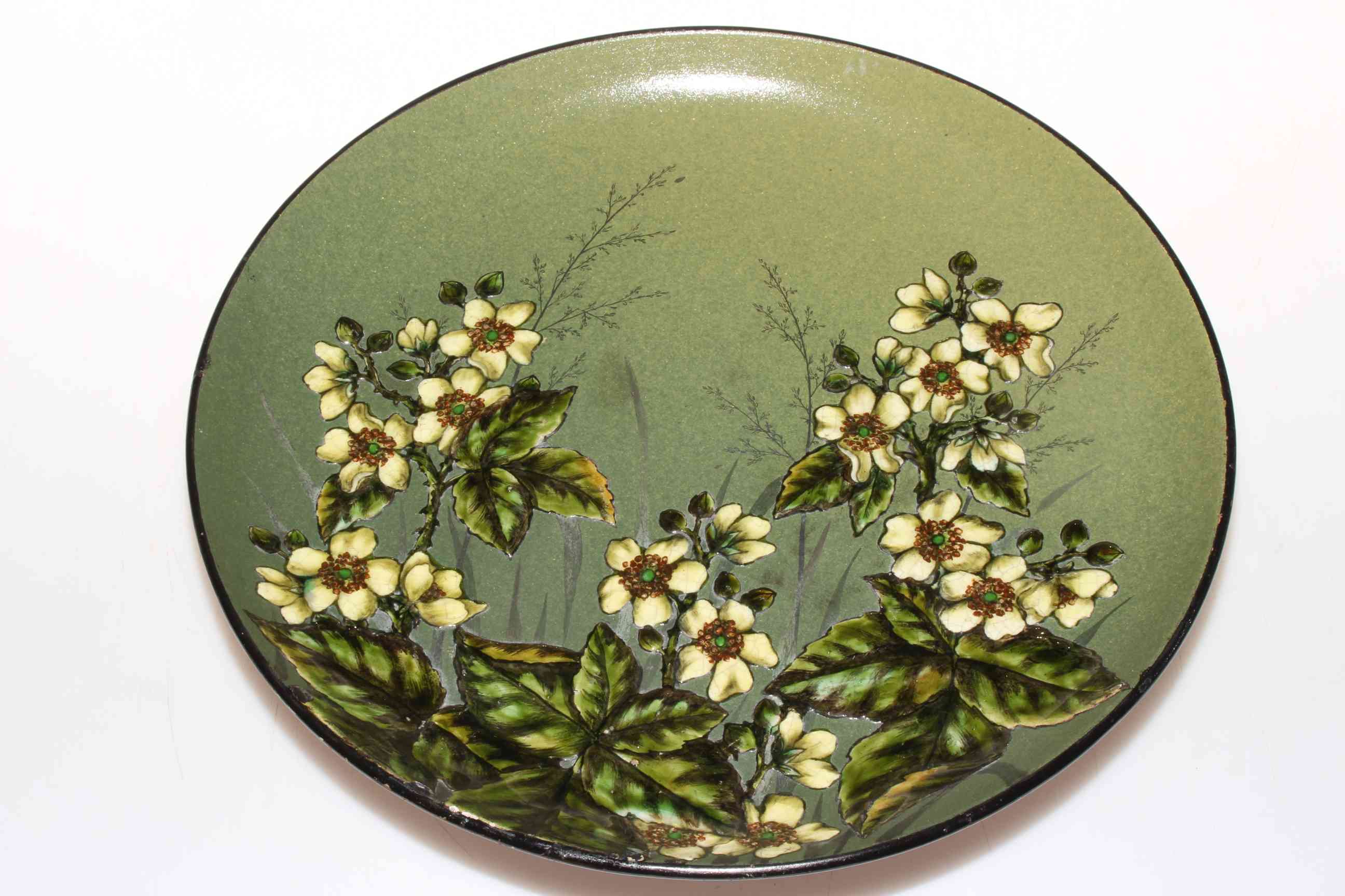 Linthorpe Pottery Henry Tooth circular plaque with floral design, impressed no. 299, 29cm diameter.