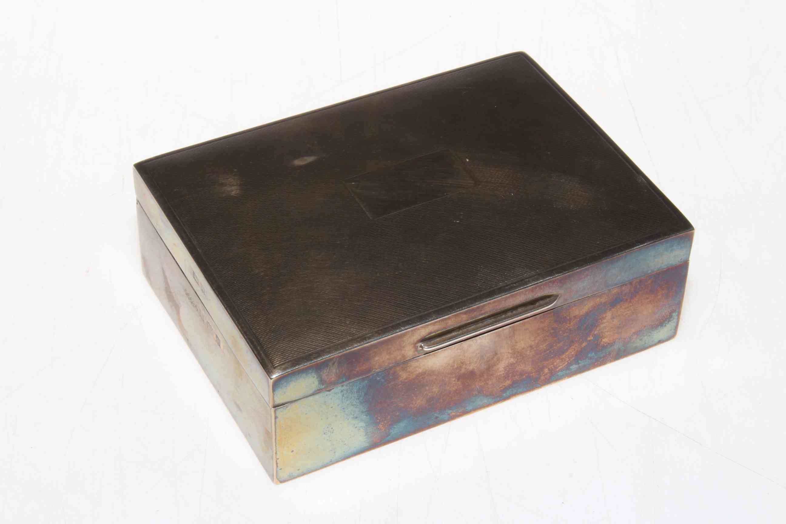 Silver cigarette box with engine turned lid, Birmingham 1965, 11.5cm across.