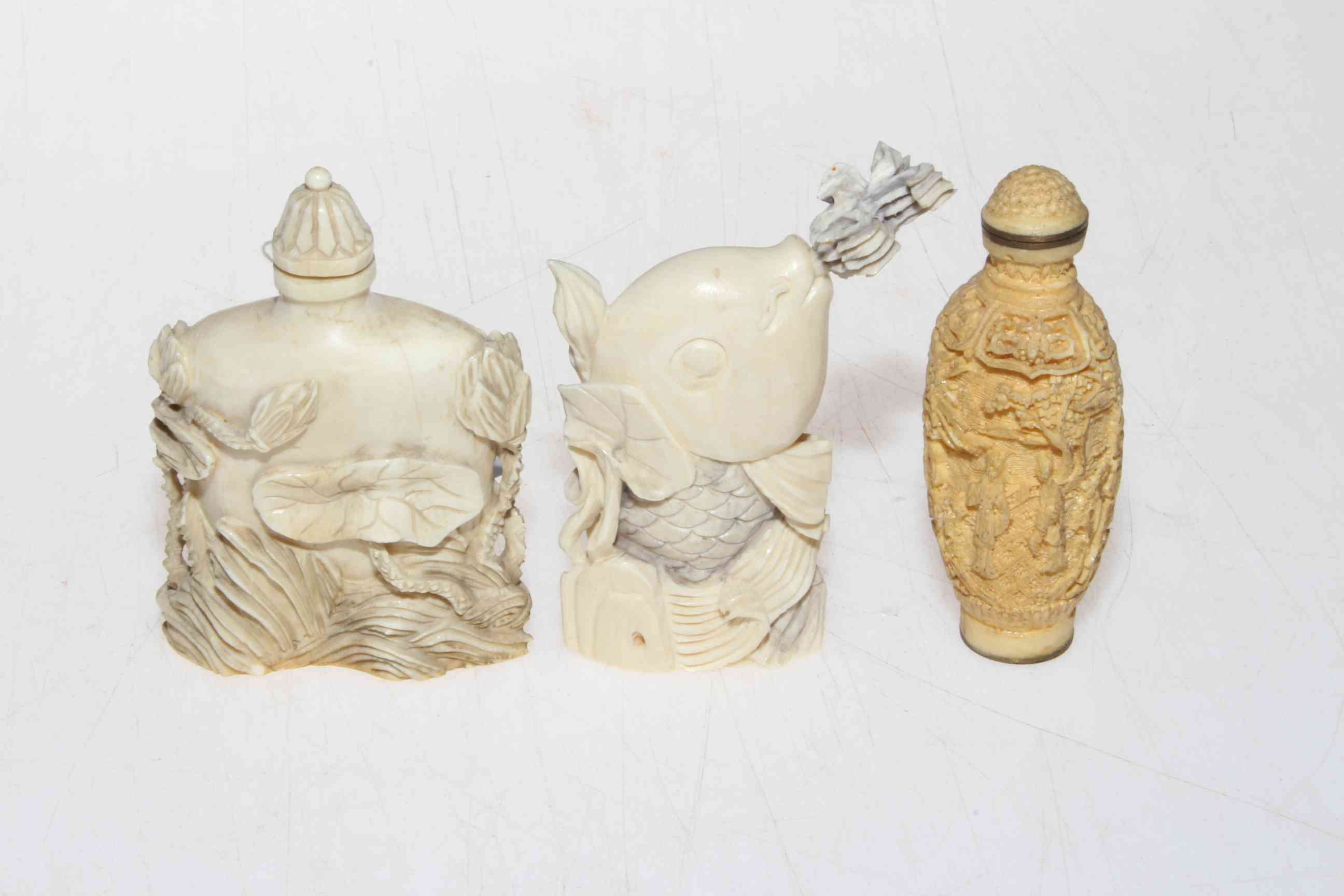 Three ivory/bone scent bottles, each approximately 8cm, all with base signature or mark. - Image 2 of 3