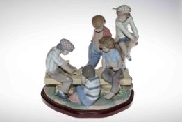 Nao Boys Playing Cards, sculptured by José Puche in 1992, 34cm high, 32cm across,