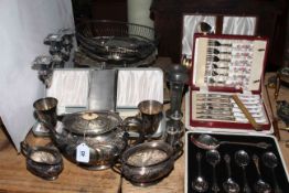 Silver plated tea set, cased cutlery, vases, baskets, etc.