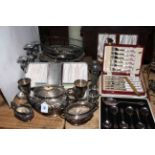 Silver plated tea set, cased cutlery, vases, baskets, etc.