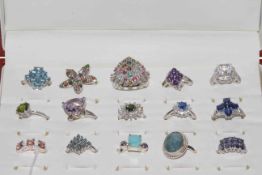 Collection of fifteen silver gem set rings including tourmaline, topaz, amethyst and peridot,