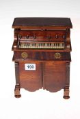 Late Victorian smokers cabinet in the shape of American organ.