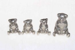 Four white metal teddy bear pepperettes, tallest 6cm high.