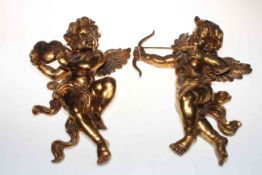 Pair of gilt winged cherub wall mounts.