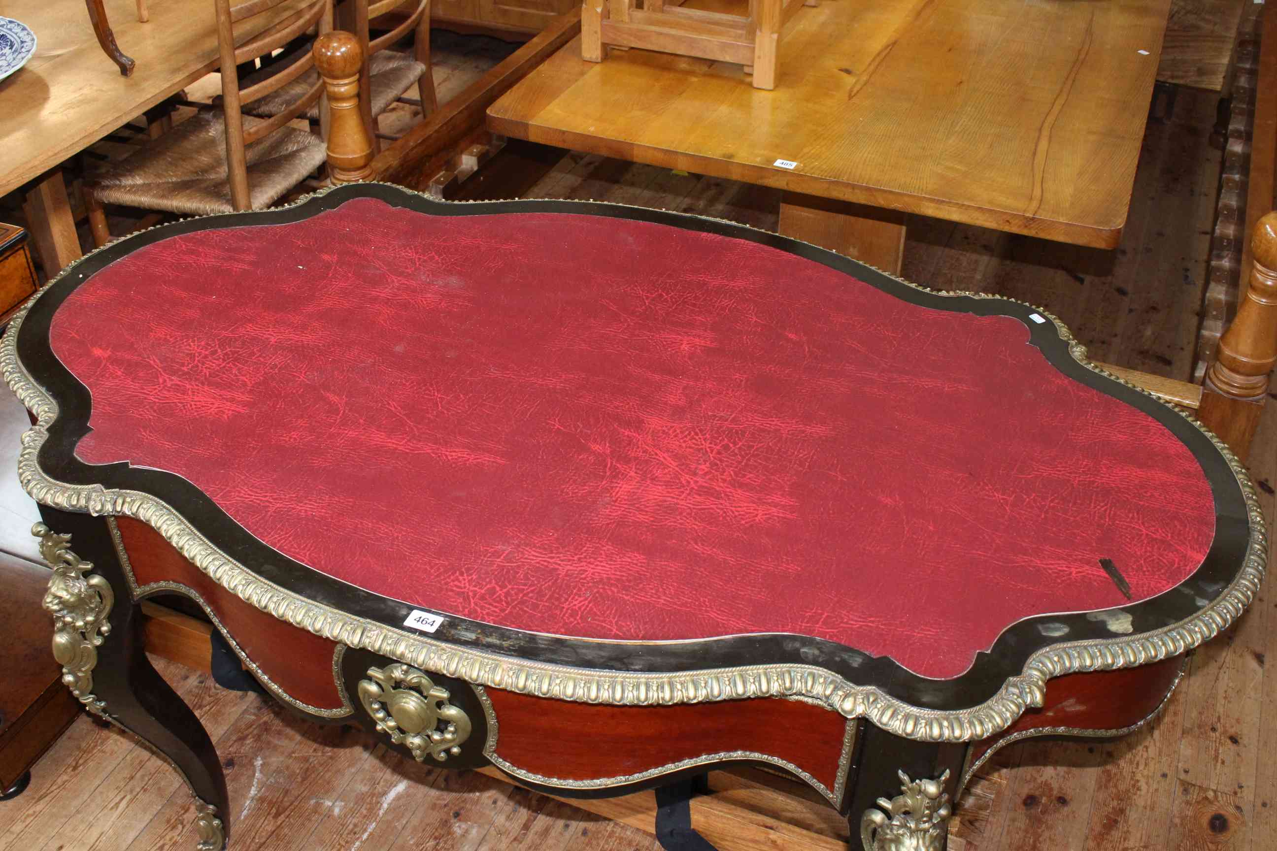 French ebonised and gilt metal mounted bureau plat, of oval shape with inset red leather, - Image 4 of 4