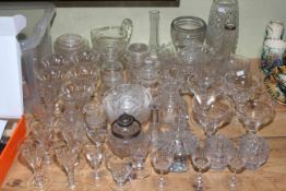 Assorted glassware including wine and champagne glasses, vases, jug, preserve jars, scent bottles,