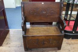 Carved oak monks bench, 73cm high by 92cm wide by 46cm deep (closed).