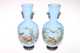 Pair Victorian blue opaque glass vases with enamelled decoration of birds and flowers, 23.5cm.