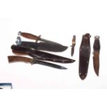 Four knives, three with sheaths, and military style compass.