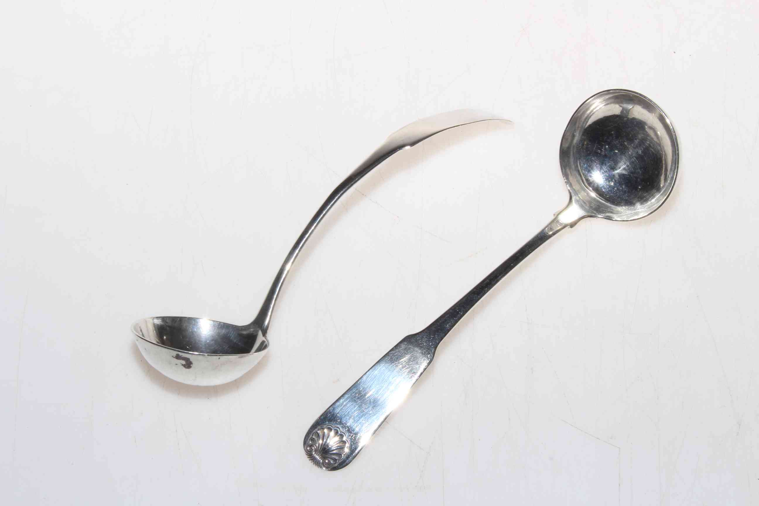 Two Edinburgh silver toddy ladles, one by George Fenwick 1815, the other with shell terminal 1823.