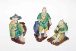 Three Chinese pottery male figures, tallest 14cm.