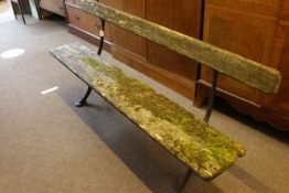 Weathered wood and cast garden bench, 81cm high by 178cm wide by 42cm deep.