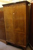 Early 20th Century mahogany and ebony line inlaid two door wardrobe on splayed bracket feet,