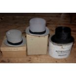 Two grey top hats with original card boxes, Alf Pellett black top hat with card box,