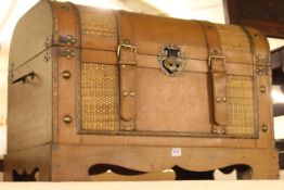 Modern leather bound dome trunk.