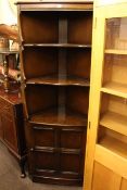 Eight piece suite of Ercol Old Colonial comprising open topped standing corner cabinet,