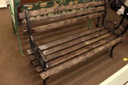 Wood slat garden bench with cast ends 71cm high by 122cm wide by 48cm deep.