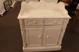 White painted two door side cabinet with wavy gallery back, 95cm high by 81cm wide by 39cm deep.