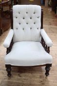 Victorian turned leg armchair in light buttoned fabric. (Slight split to frame and marks to frame).