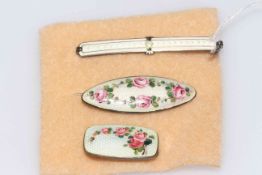 Three vintage guilloche enamel brooches, the rectangular brooch by Aksel.